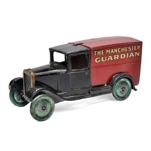 Dinky No. 28C Pre-war Delivery Van - The Manchester Guardian. Black and Red with gold lettering with black outline depicting 'The Manchester Guardian'. Tinplate radiator surround and solid metal wheels with purple colour wash. Displays very good to excellent (for age). Some expected surface marks and blemishes, but mostly minor, as shown.