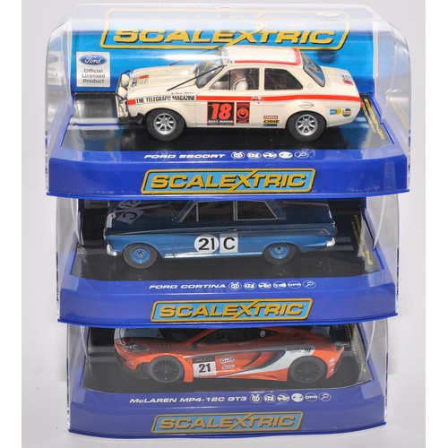 A trio of boxed Scalextric cars. Individual models comprise 1) McLaren MP4 - 12C GT3 No 21 United Autosport's Gulf Livery, 2) Ford EscortMk1 (London/Mexico), 3) Ford Cortina GT 1964 Bathurst Ian & Leo Geoghegan .  All appear mostly excellent in original boxes, from an ex-shop collection.
