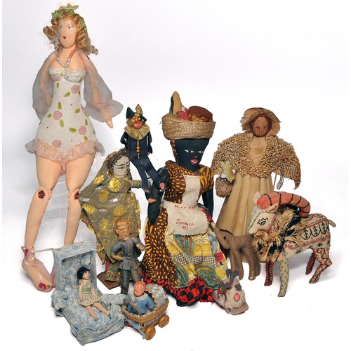A selection of Vintage handcrafted dolls and figures to include clothes ...
