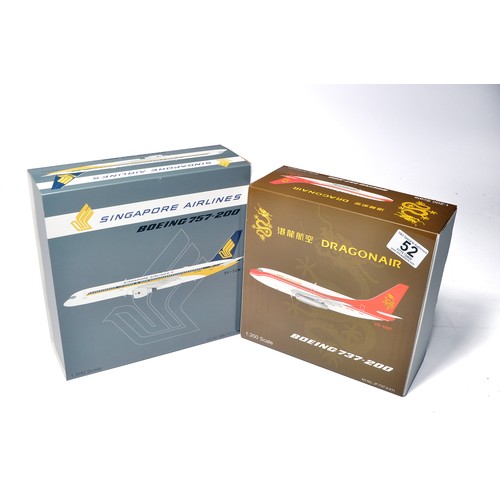 52 - A duo of diecast model aircraft  1/200 scale issues comprising 1) Singapore Airlines Boeing 757-200,... 