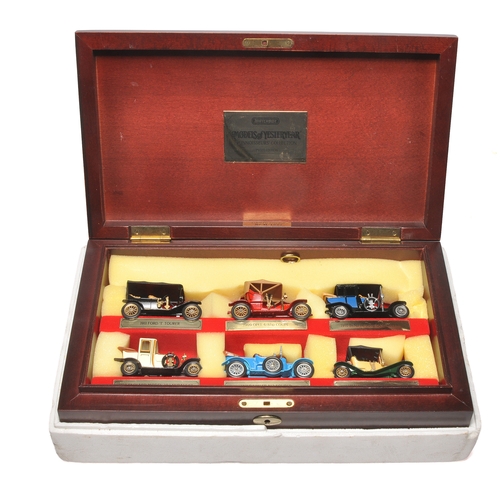 639 - A set of Matchbox Models of Yesteryear diecast vehicles, presented in a wooden display case with red... 