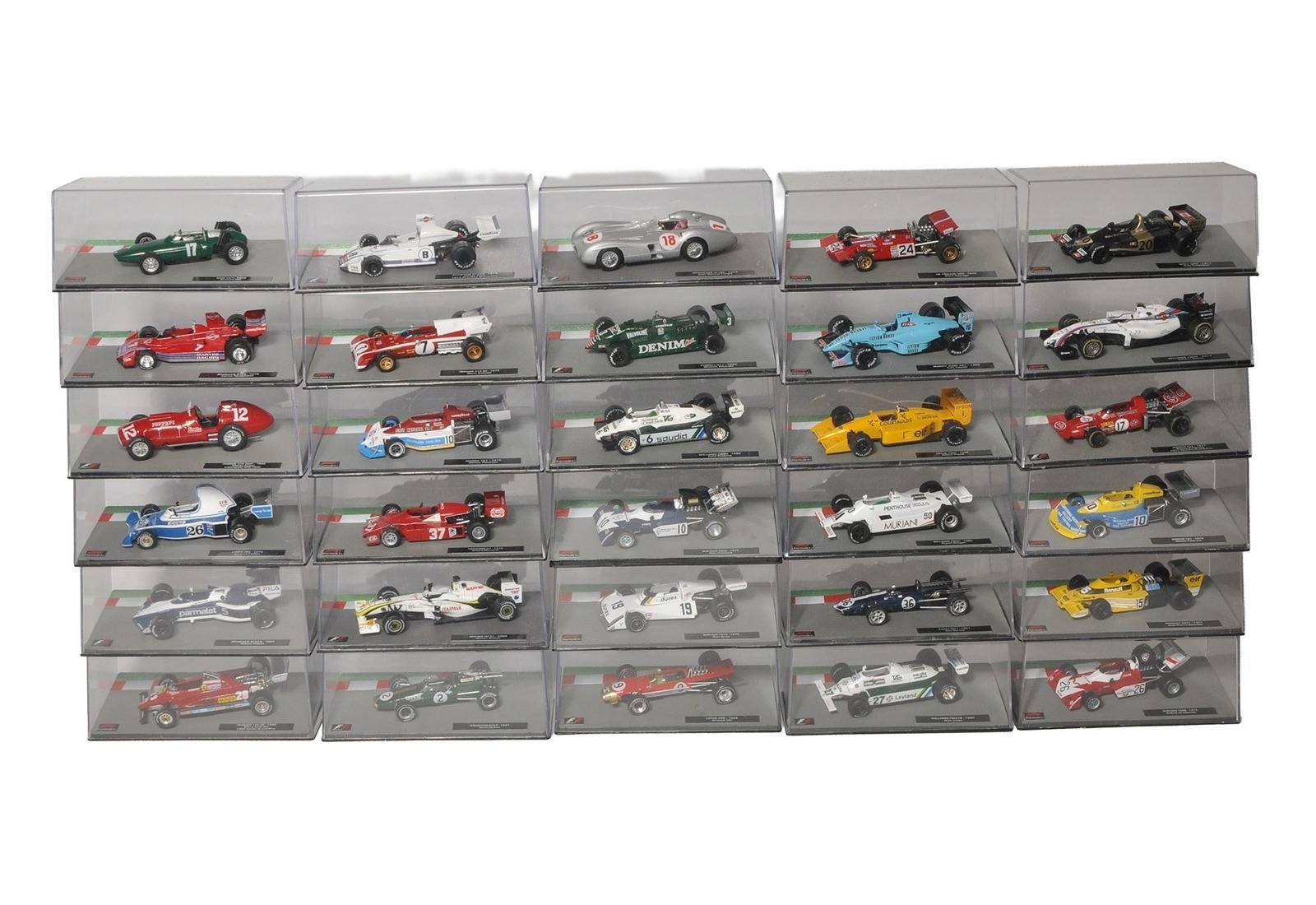 A large collection of diecast Formula 1 racing car models, each housed ...