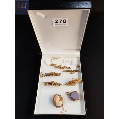 278 - Quantity of 9 carat gold brooches etc