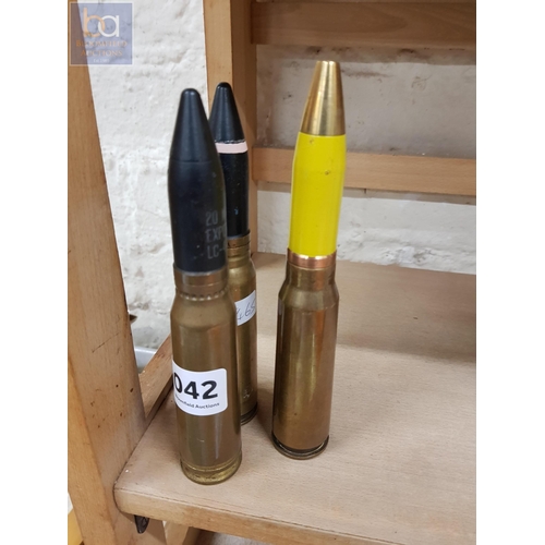 42 - 3 LARGE SPENT BULLET SHELLS