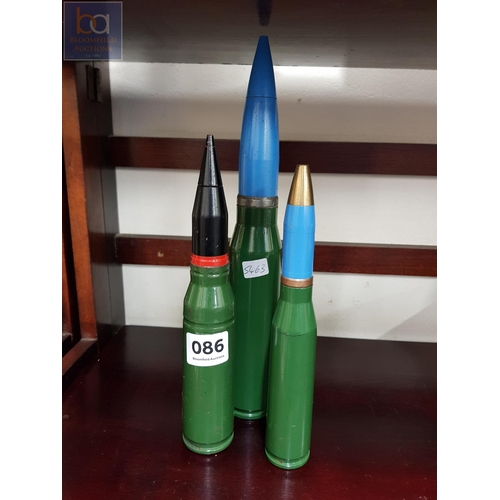 86 - 3 LARGE SPENT BULLET SHELLS