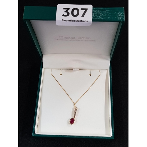 307 - 9 CARAT GOLD RUBY AND DIAMOND DROP ON GOLD CHAIN