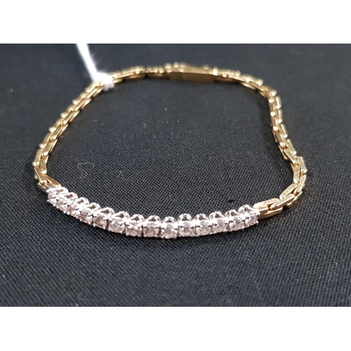 309 - 18 CARAT GOLD BRACELET WITH 14 DIAMONDS