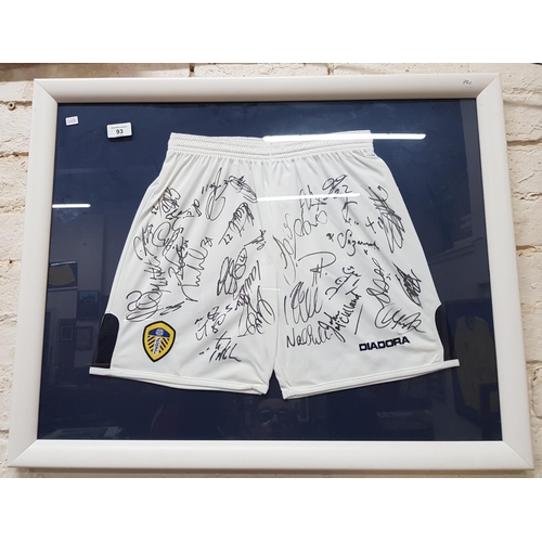 93 - FRAMED SIGNED LEEDS UNITED SHORTS WITH C.O.A