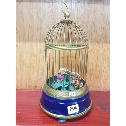 206 - VINTAGE BIRD CAGE WITH CHIRPING BIRD