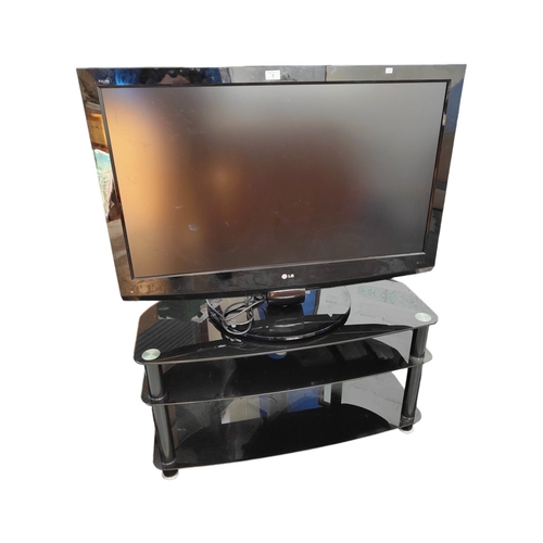 2 - LG TELEVISION WITH BLACK GLASS STAND