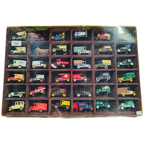 284 - DISPLAY CASE WITH MODEL WAGONS