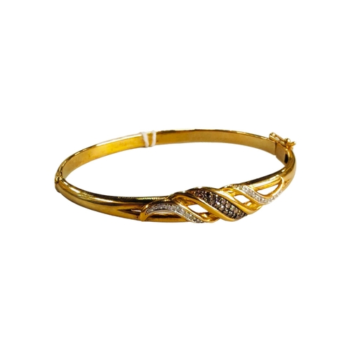 399 - YELLOW METAL BLACK AND WHITE DIAMOND BANGLE