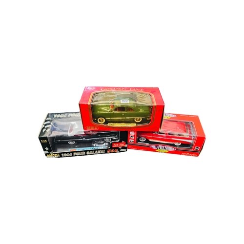 22 - 3 BOXED LARGER SCALE MODEL CARS