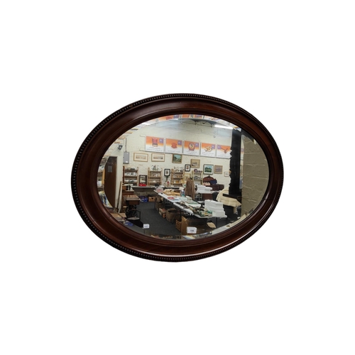 199 - LARGE OVAL MAHOGANY WALL MIRROR