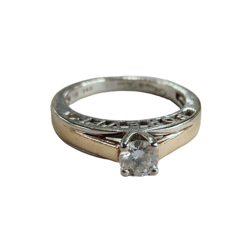 310 - 14K WHITE AND YELLOW GOLD DIAMOND SOLITAIRE RING WITH CIRCA 0.25 CARAT OF DIAMONDS