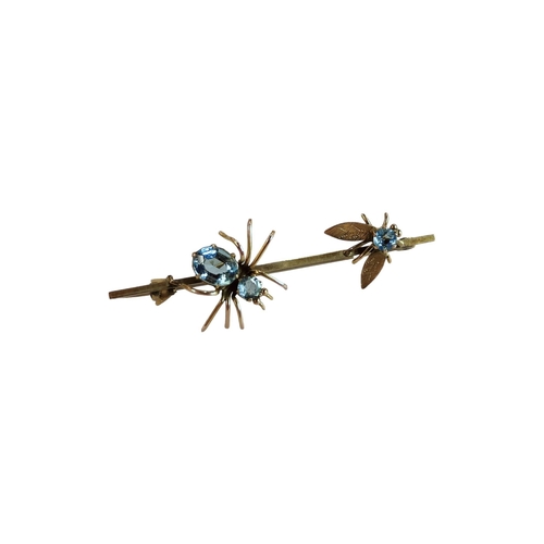 323 - 9 CARAT GOLD AQUA MARINE SET SPIDER & THE FLY BROOCH