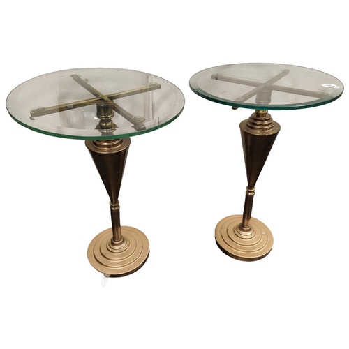 124 - A PAIR OF BRASS AND GLASS LAMP TABLES