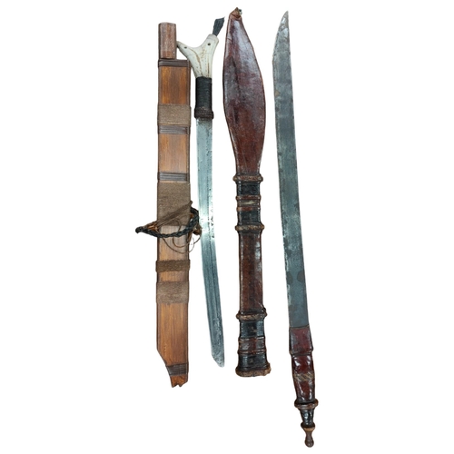 218 - 2 X TRIBAL SWORDS & SHEATHS