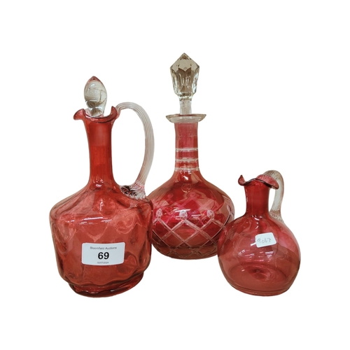 69 - 3 RUBY/CRANBERRY GLASS DECANTERS