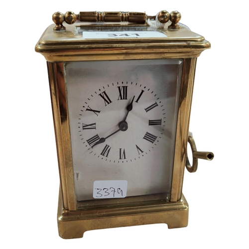 341 - EDWARDIAN BRASS CARRIAGE CLOCK AND KEY