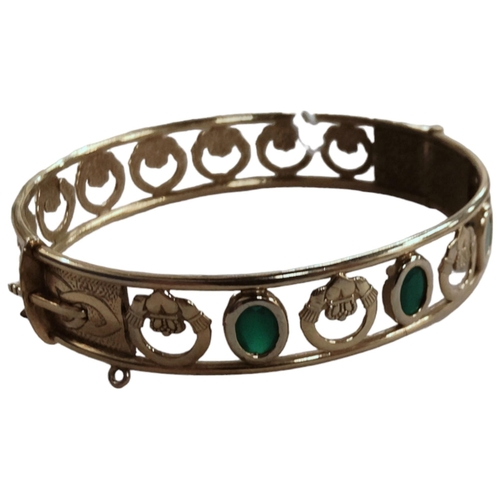 378 - GOLD PLATED CELTIC CLADDAGH BANGLE SET WITH GREEN STONES