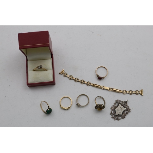 72 - 9ct Ring, Five Dress Rings, Gold Plated Strap and a Silver Medallion