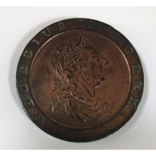 1095 - A GEORGE III TWOPENCE PIECE. A George III 'Cartwheel' twopence piece dated 1797, with traces of copp... 