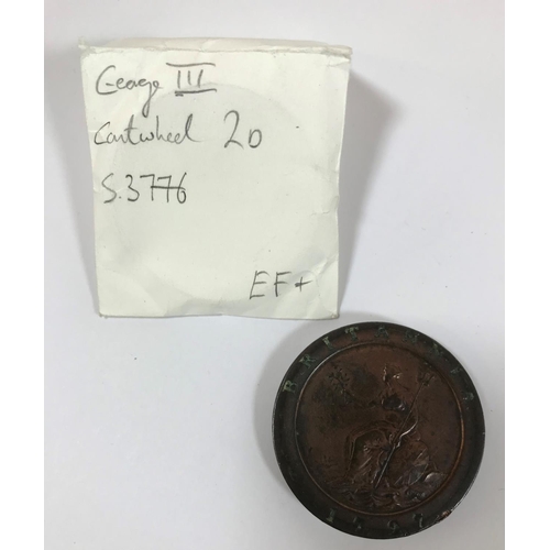 1095 - A GEORGE III TWOPENCE PIECE. A George III 'Cartwheel' twopence piece dated 1797, with traces of copp... 