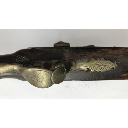 402 - A 19TH CENTURY PERCUSSION FIRING RIFLE. A three quarter size rifle with 63.5cm barrel tapering from ... 