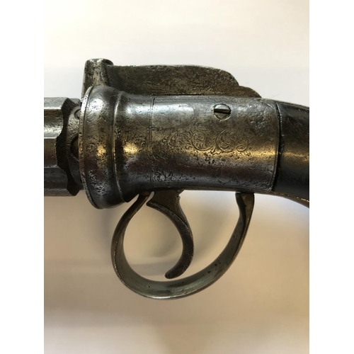 405 - A PEPPER BOX TYPE REVOLVER. An English Six Barel Pepper Box type revolver with a rotating 8cm barrel... 