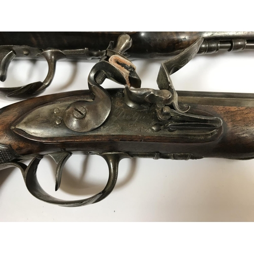 413 - A PAIR OF FRENCH FLINTLOCK PISTOLS BY DELPINE. A pair of flintlock Officers pistols with octagonal m... 