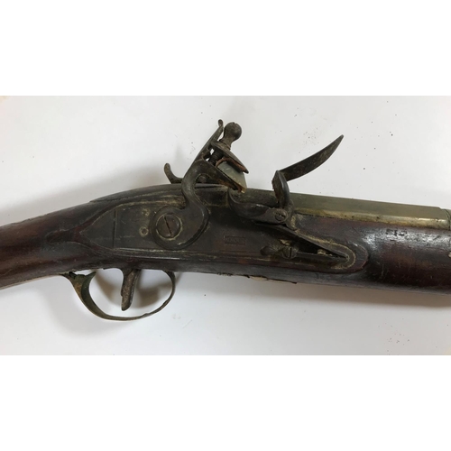 420 - A BRASS BARREL BLUNDERBUSS MARKED H.NOCK. A brass barrel blunderbuss by H.Nock, with flared barrel, ... 