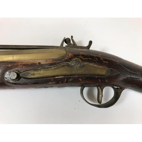 421 - A BRASS BARREL BLUNDERBUSS MARKED H.NOCK. A brass barrel blunderbuss by H.Nock, with flared barrel, ... 