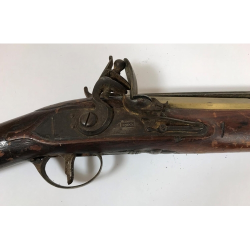 421 - A BRASS BARREL BLUNDERBUSS MARKED H.NOCK. A brass barrel blunderbuss by H.Nock, with flared barrel, ... 