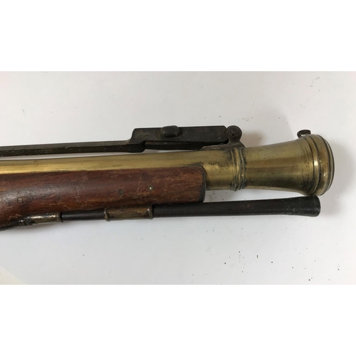 421 - A BRASS BARREL BLUNDERBUSS MARKED H.NOCK. A brass barrel blunderbuss by H.Nock, with flared barrel, ... 