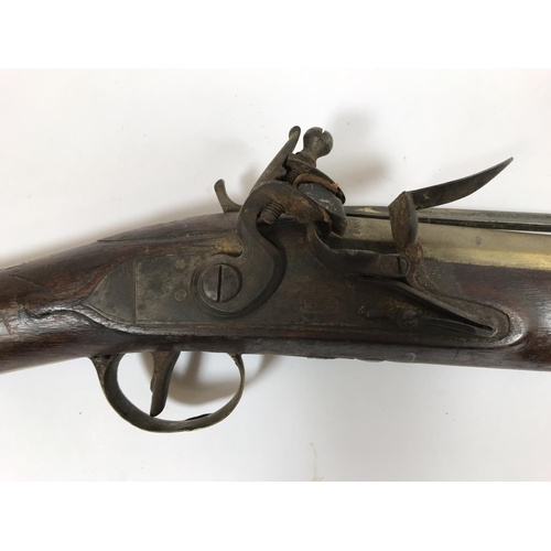 422 - A BRASS BARREL BLUNDERBUSS MARKED H.NOCK. A brass barrel blunderbuss by H. Nock, with flared barrel,... 