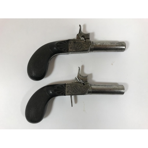 431 - TWO PAIRS OF POCKET PISTOLS. A pair of percussion cap pocket pistols with octagonal screw off barrel... 