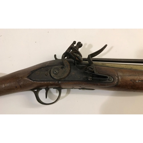 434 - AN IRON BARREL BLUNDERBUSS. An iron barrel flintlock blunderbuss with slightly flared barrel, brass ... 