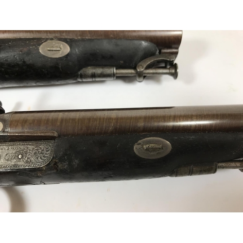 461 - A PAIR OF DOUBLE BARREL PISTOLS BY MAYBURY AND SONS. A pair of double barrel 'Howdar' type percussio... 