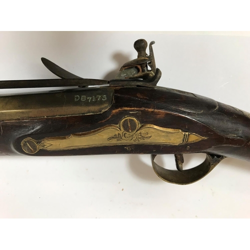 475 - A BRASS BARREL BLUNDERBUSS STAMPED H. NOCK. A brass barrel flintlock blunderbuss by H. Nock, with fl... 