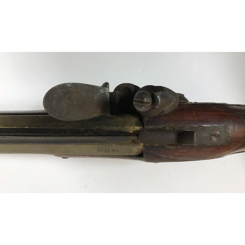 476 - A BRASS BARREL BLUNDERBUSS MARKED H. NOCK. A brass barrell flintlock blunderbuss by H. Nock, with fl... 