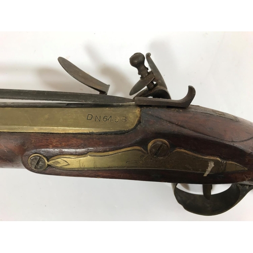 476 - A BRASS BARREL BLUNDERBUSS MARKED H. NOCK. A brass barrell flintlock blunderbuss by H. Nock, with fl... 