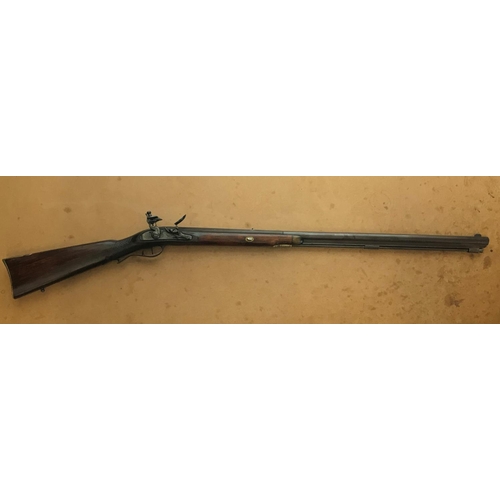 480 - A REPRODUCTION AMERICAN FLINT LOCK MUZZLE LOADING GUN. A reproduction American style flint lock muzz... 