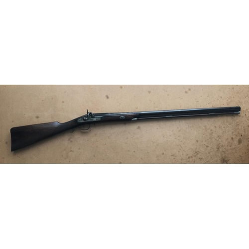 481 - A REPRODUCTION 12 BORE PERCUSSION CAP GUN. A reproduction 12 bore muzzle loading gun with an 81.5 cm... 