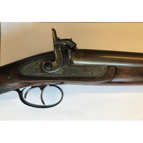 485 - A REPRODUCTION PERCUSSION CAP DOUBLE BARREL SPORTING GUN. A reproduction 12 bore side by side doubel... 