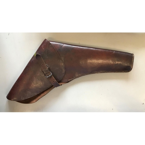 496 - A LEATHER PISTOL HOLSTER. A large leather pistol holster with buckle and strap fastening, probably S... 