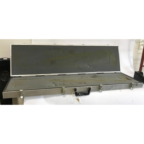 502 - AN ALUMINIUM FIREARMS TRANSPORT CASE. A foam lined aluminium travelling case with four catches and s... 