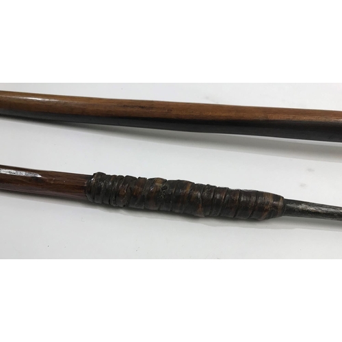 519 - A ZULU SPEAR AND A WOODEN KNOB KERRIE. The spear pointed leaf shaped tip bound to a patinated shaft,... 