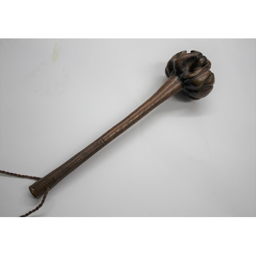 521 - FIJIAN ULA TRIBAL THROWING CLUB with a natural root head, the shaft with incised decoration includin... 