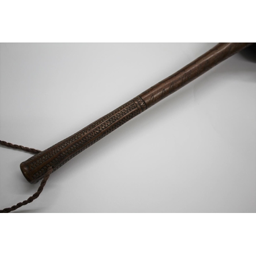 521 - FIJIAN ULA TRIBAL THROWING CLUB with a natural root head, the shaft with incised decoration includin... 